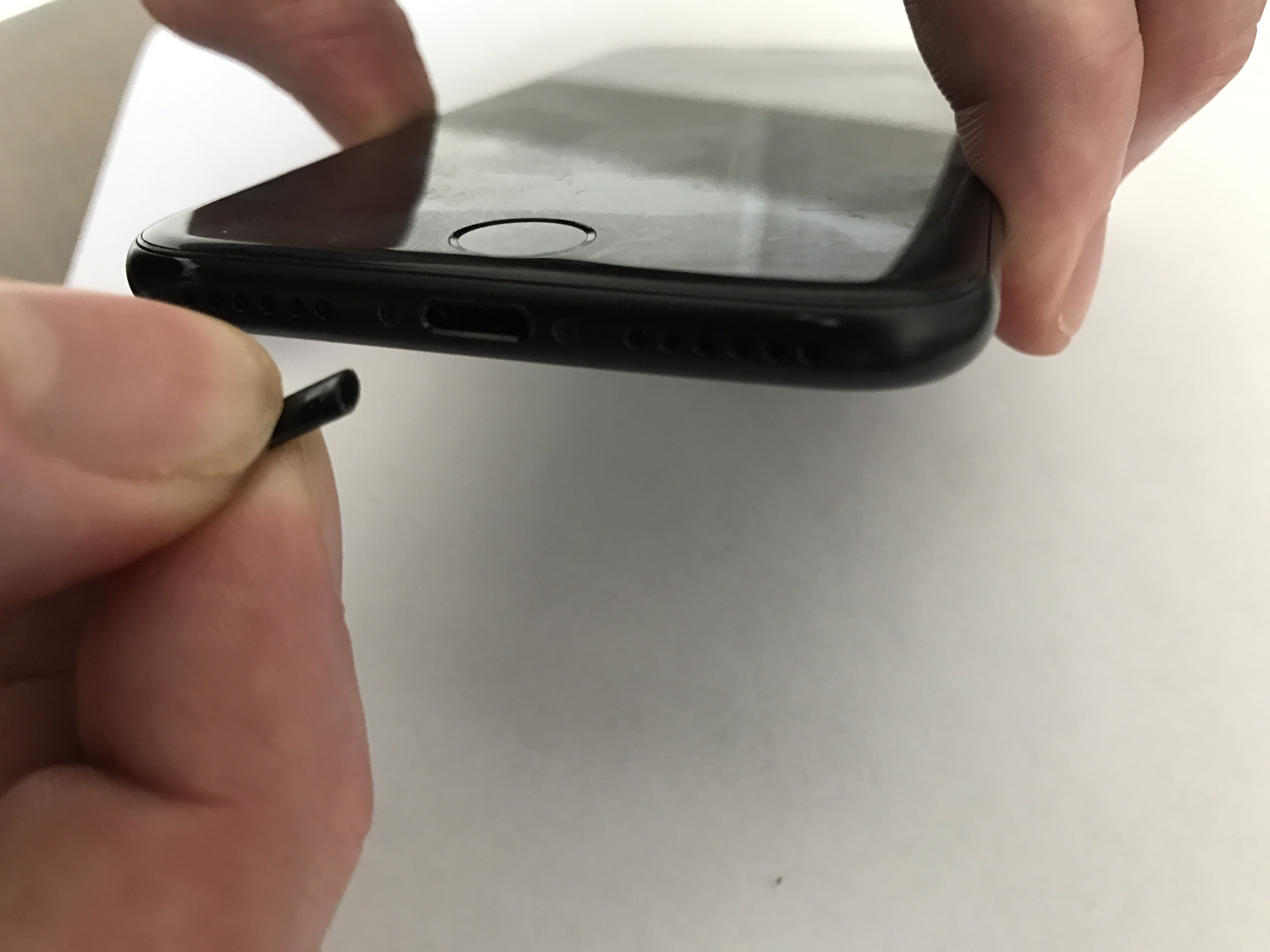 pinch tip of cocktail straw to clean lightning port