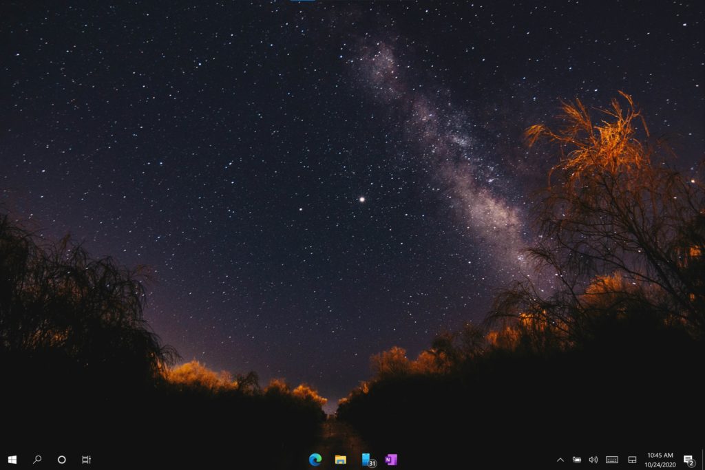 Liam's desktop with a starry wallpaper