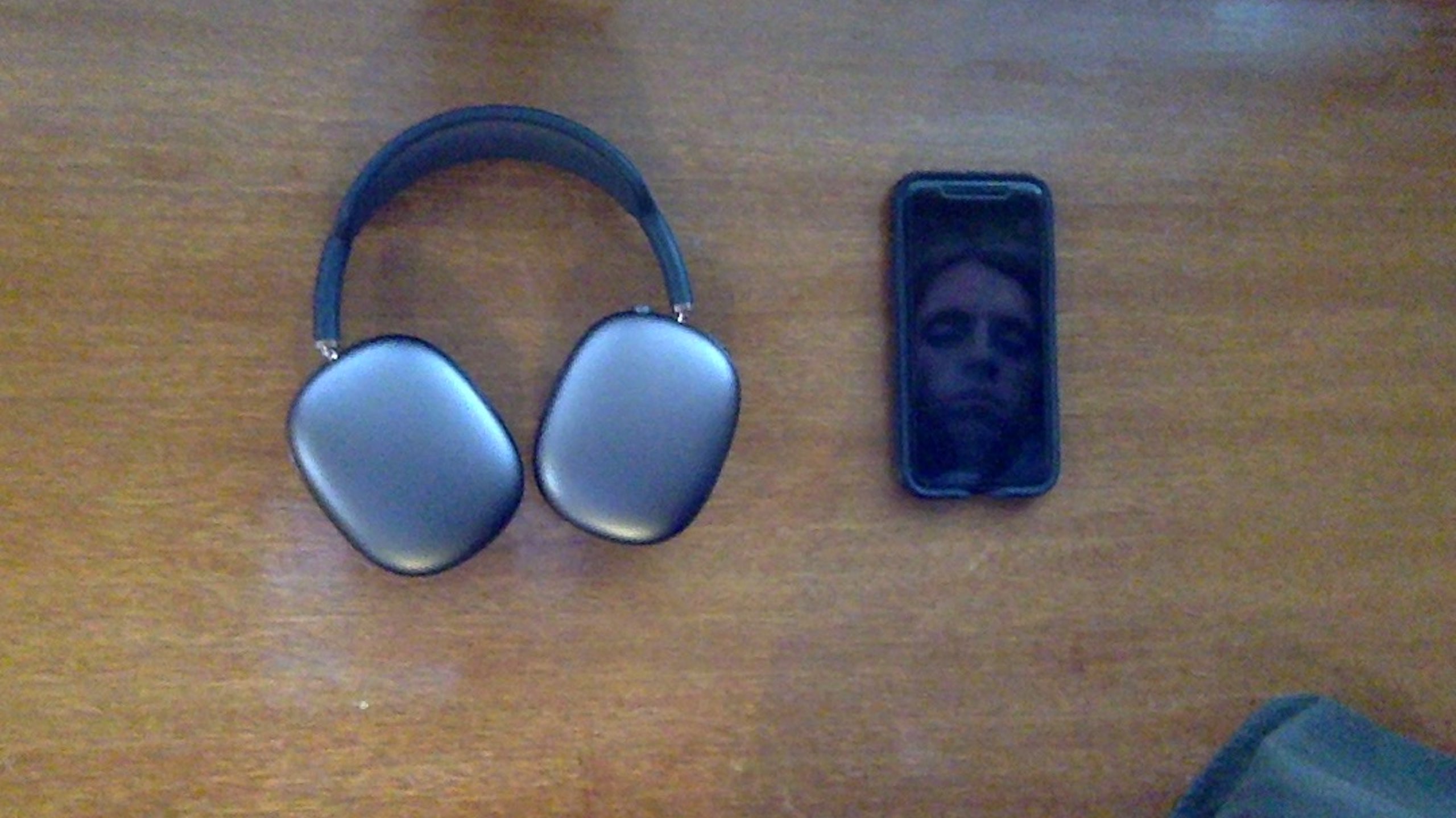 iPhone next to AirPods Max