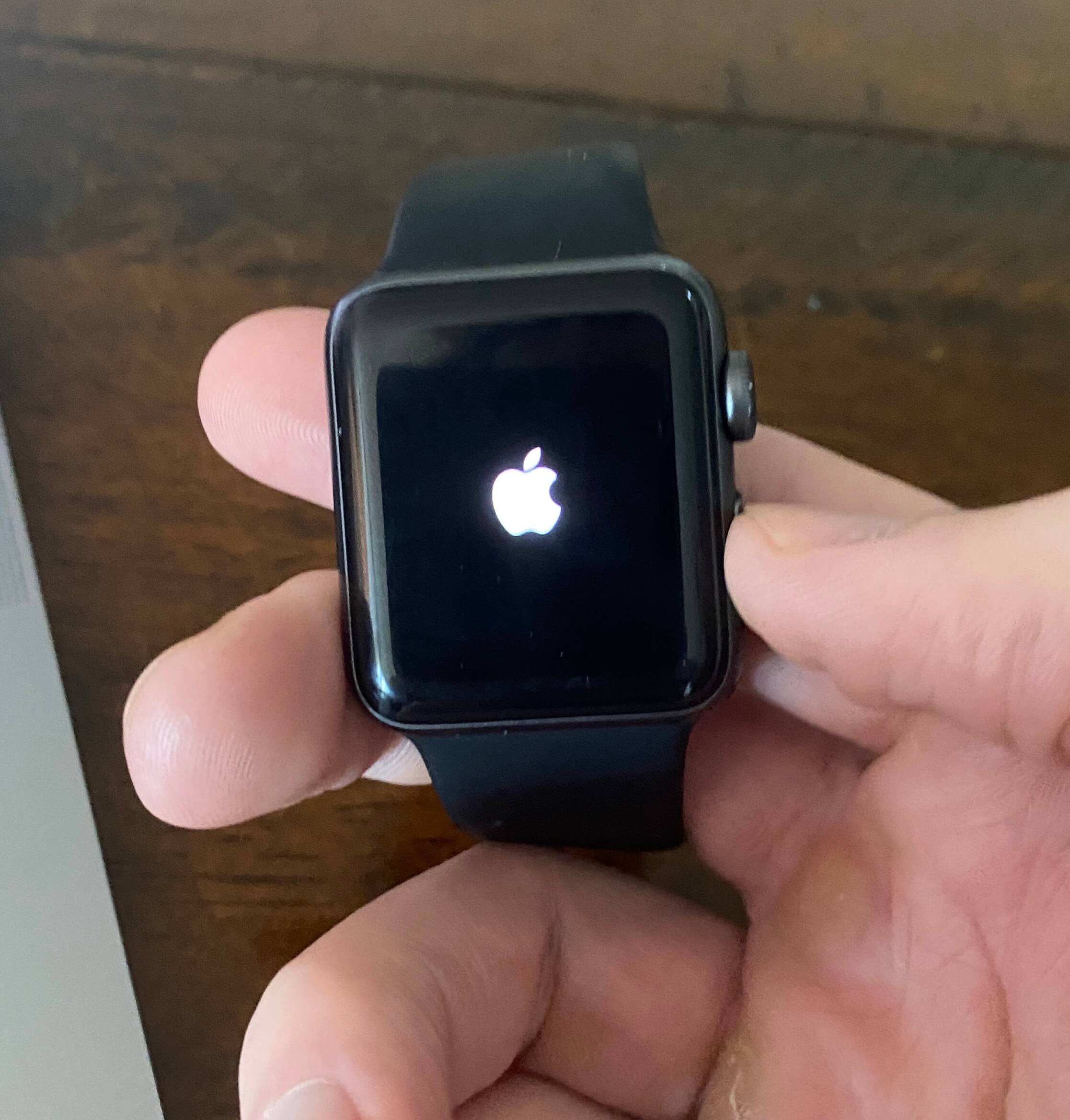 apple logo on apple watch face